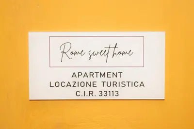 a sign on a wall that says rent stuff home apartment at 81 mq, Stazione trastevere, Rome Sweet Home in Rome