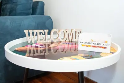 a white coffee table with a box on top of it at 81 mq, Stazione trastevere, Rome Sweet Home in Rome