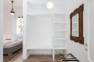 a bedroom with a bed and a mirror at Trastevere novecento in Rome