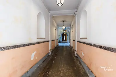 an empty hallway in an old building with a hallway at Maison Borghetto - Vatican House in Rome