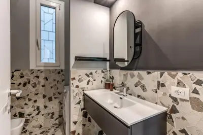 a bathroom with a sink and a mirror at Residenza Nemorense in Rome
