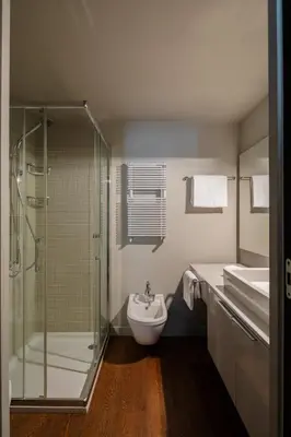 a bathroom with a shower and a sink and a toilet at 2 bedrooms flat near Via Veneto in Rome