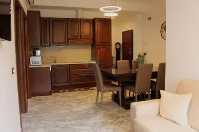 a kitchen and dining room with a table and chairs at Mary's Suite Aventino in Rome