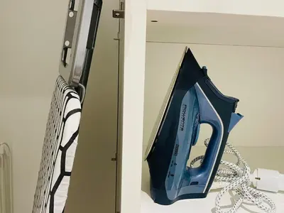 a blue appliance is on a shelf in a room at Bright Vatican Apartment in Rome