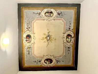a picture of a framed mirror on a wall at Maison Borghetto - Vatican Flat in Rome