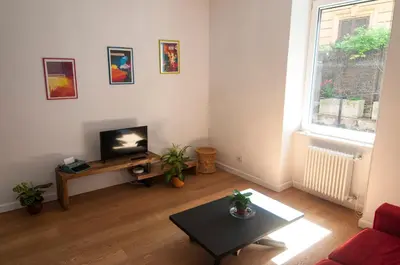 a living room with a television and a coffee table at Perfect Hideout in Trastevere in Rome