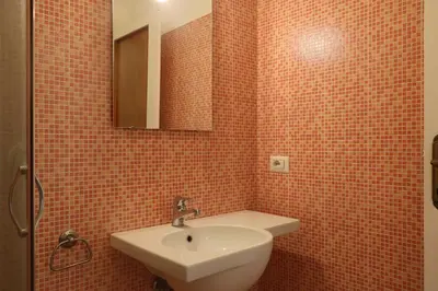 a bathroom with a sink and a mirror at Rome Sleep Home Bed & Breakfast in Rome
