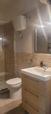 a bathroom with a toilet and a sink at Aventino Flat in Rome