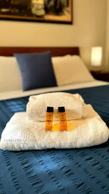 two towels sitting on top of a bed at Aventino Flat in Rome