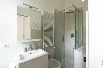a bathroom with a shower and a sink and a toilet at Vatican Cosy Apartment in Rome
