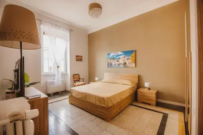 a bedroom with a bed and a television in it at Grazioli Vatican Home in Rome