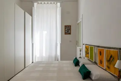 a living room with a couch and a window at Casa Dandolo - Pretty Homes in Rome