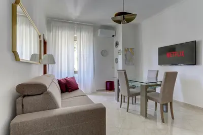 a living room with a couch and a table at Vatican Apt Doria 64 - Home and More in Rome