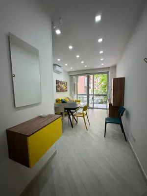 a living room with a table and a dining room at BALDO 352 HOME in Rome