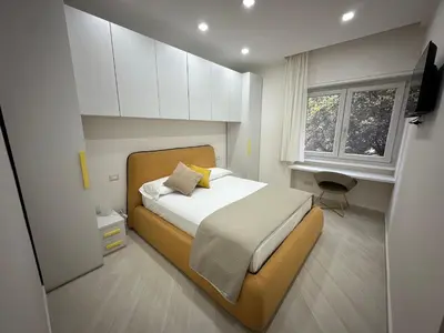a bedroom with a bed and a window at BALDO 352 HOME in Rome