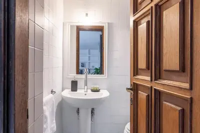 a bathroom with a sink and a mirror at Domus Fori Imperiali in Rome