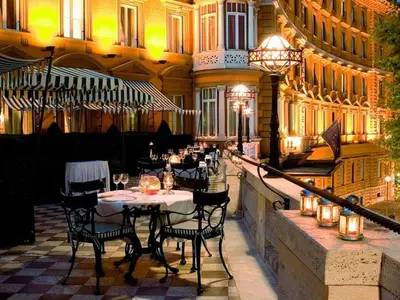 a restaurant with a table and chairs in a building at Via Veneto Luxury House in Rome