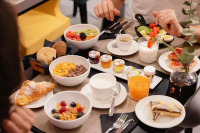 a breakfast table with breakfast foods and drinks at Dream Suite Trevi in Rome