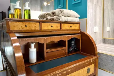 a wooden chest with towels in a bathroom at Madame Sofia Exclusive Collection Spanish Steps - HOME Apartment-Suites in Rome
