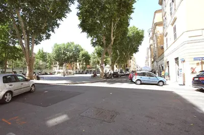 a street with cars parked on the side of the road at Testaccio View Holiday House in Rome