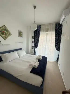 a bedroom with a large white bed in a room at casa celeste, Roma in Rome