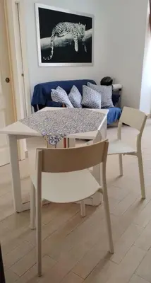 a table and a chair and a table and a table and a table at casa celeste, Roma in Rome