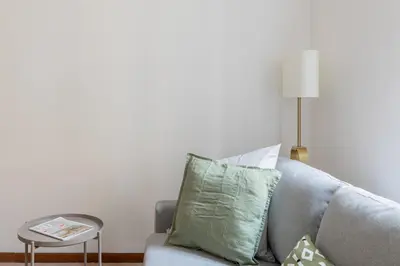 a living room with a couch and a table at iFlat Comfortable Apartment next to the Vatican in Rome