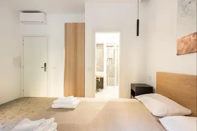 a bedroom with a bed with two towels on it at Roma private rooms Vatican City in Rome