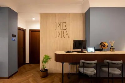 an office with a desk with a computer on the wall at Boutique Hotel Piedra Rome City Centre in Rome