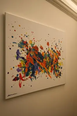a framed painting of a paint splash on a wall at Like at Home Trastevere in Rome