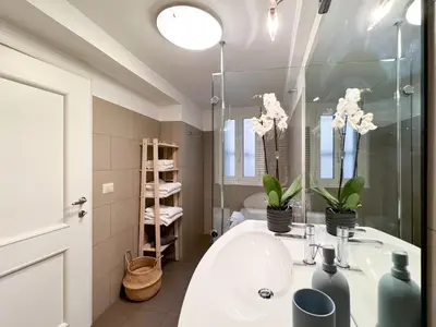 a bathroom with a sink and a mirror at Banchi Vecchi Stay Apt Suite Pantheon in Rome