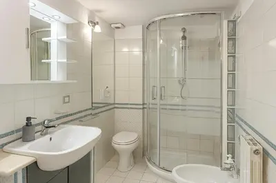 a bathroom with a sink and a toilet and a shower at S&M Guest Home - San Giovanni in Rome