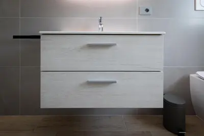 a bathroom with a sink and a toilet at Marconi white flower house in Rome