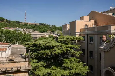 a tree is growing in front of a building at Vatican Zen House - Cale 05 in Rome