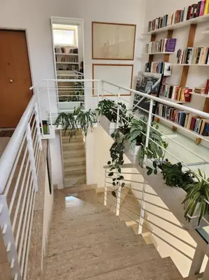 a staircase with a bunch of plants on it at Appartamento Loft ex mulini in Rome