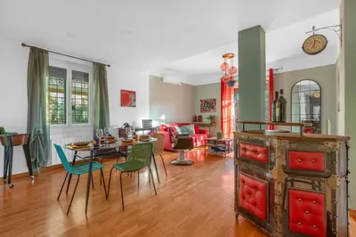 a living room with a table and chairs at Conca D'Oro Terrace in Rome