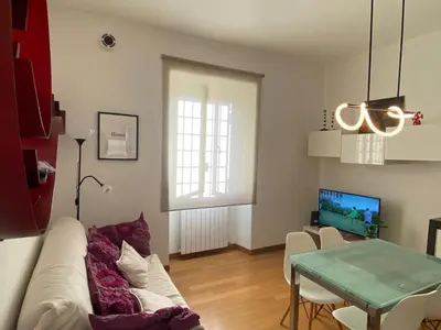 a living room with a couch and a table at Fanfulla Bilocale Pigneto in Rome