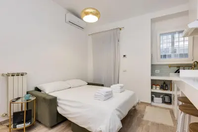 a bedroom with a bed with towels on it at Cozy Apartment Monteverde near Trastevere in Rome