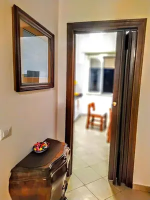 a room with a mirror and a bowl of candy at Loryand near Stadio Olimpico in Rome