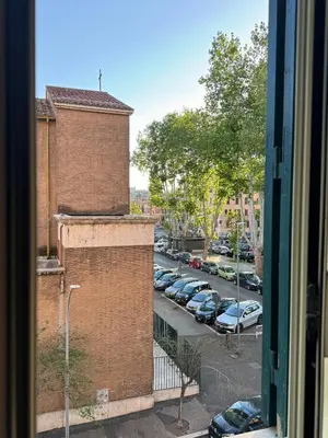 a view from a window of a parking lot at Dora Apartment in Rome