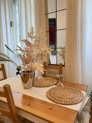 a table with two placemats on top of it at Residenza AURELIA in Rome