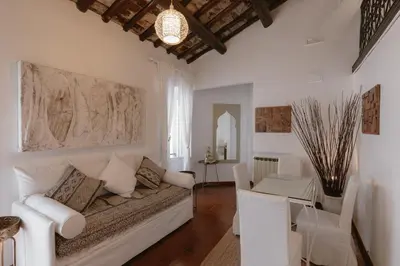 a living room with a couch and a table at Piazza Navona Historic Luxury Apartment in Rome
