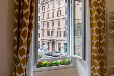 a window with a view of a city street at SCIPIONI 40 GUESTHOUSE in Rome