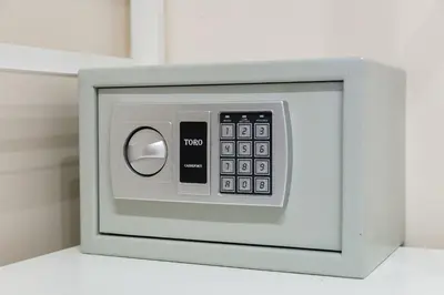 a microwave oven with a remote control in it at SCIPIONI 40 GUESTHOUSE in Rome