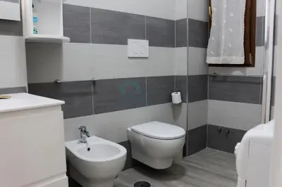 a bathroom with a toilet and a sink at Your Perfect Roman Getaway in Vatican in Rome