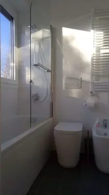 a bathroom with a shower and a toilet and a sink at Quadrilatero Flat in Rome