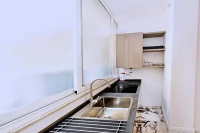 a kitchen with a sink and a window at Vatican Suites in Cola Di Rienzo in Rome