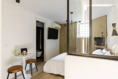 a bedroom with a bed and a table and chairs at MauveSweetRhome 4 in Rome