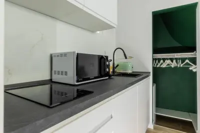 a microwave sitting on a counter in a kitchen at MauveSweetRhome 4 in Rome