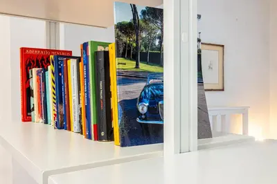 a living room with a table and a couch at Milvio Urban House in Rome